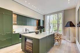 Everyone always seems to gather in their kitchen, and this was open to both the family and dining rooms, so my goal was to create a mix of classic and modern, happy and sophisticated, with some moments, she says. Dark Green Kitchens 20 Gorgeous Ideas For Those Who Love An Overload Of Green