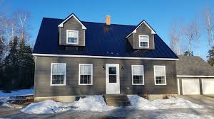 The way to create the look is by pairing a light blue house and chrome metal roofing. Metal Roof Siding Holden Maine Ron Bragg