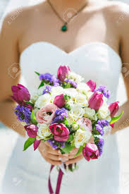 Maybe you would like to learn more about one of these? Wedding Bouquet White Pink Purple Flowers In The Hands Of Stock Photo Picture And Royalty Free Image Image 54810794