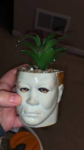 How to remove glued fake rocks from planters?