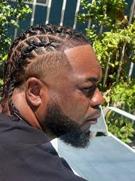 Who can retwist waist-length dreadlocks and do 2 or 3 strand twists in Las  Vegas?