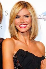 The roots are darker than the predominantly blonde. Star Style Heidi Klum S Striking Look Stylebakery Hair Styles Heidi Klum Hair Medium Hair Styles