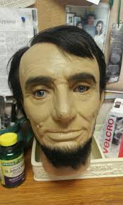 Melting wax Lincoln sculpture in DC's hot summer