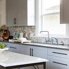 In reality even white, grey and black have hues, so i have provided some good ideas of combination of backsplash tile with white cabinets. Grey Kitchen Cabinets White Countertops Design Ideas
