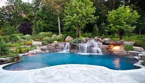 A giant spa and pool with waterfall, slide and stone deck; Pin On Dreams