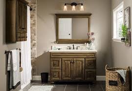 Consider adding a skylight, window or additional lighting fixtures to visually enlarge a small bathroom. Bathroom Tiles Lowes Bathroomdesignlowes Tile Bathroom Earth Tone Bathroom Small Bathroom Remodel