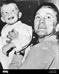 Kirk Douglas relaxing off-screen ith his son Peter. 1956. Kirk Douglas (born  Issur Danielovitch Demsky; December 9, 1916
