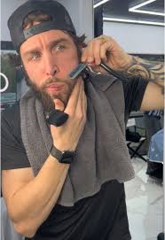 Guy Rolling Up Beard for Work