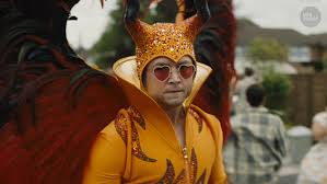 Harry styles dressed up as elton john for a beverly hills halloween party on october 26, and one fan discovered a secret meaning behind the costume. Rocketman Elton John S Outrageous Outfits Are The Shining Stars