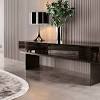 View full details % quick shop corina coffee table $789.00 | / corina coffee table simplistic industrial style console table, constructed in an aged black iron featuring a cast textured aluminum. 1