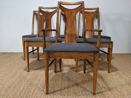 The sleek design of this contemporary marvel combines a softly curved hardwood walnut frame with an elegantly padded back. Mid Century Modern T Back Dining Chairs Gray Upholstery Lenoir Chair Company Epoch