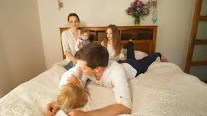 She draws her attention by spreading her legs. Naughty Family Mom With Children Climb O Stock Video Pond5