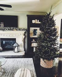 A chi and unfussy way to hide the base of your christmas tree. Christmas Tree In A Basket Life Love Larson