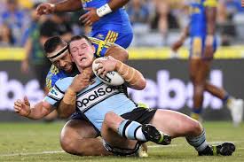 Debuting with cronulla in round 15 of 2001, paul gallen has since gone on to play 259 games with the club and will trot out for his sixteenth season as a shark in 2016. Paul Gallen Is Taken Down In A Tackle Abc News Australian Broadcasting Corporation