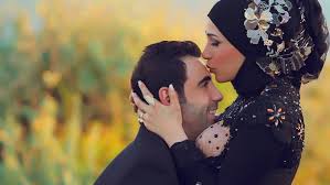 Beautiful wife taking photo of husband on smartphone. Strong Islamic Wazifa For Husband Wife Love Wazifa For Love Marriage