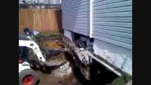 I have a house currently under construction and the builder placed an egress window under the non opening side of my sliding glass door. Installing A Full Basement Under A Existing House Youtube