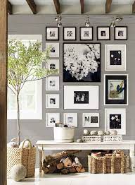 Without natural light, you'll need to rely on installed lighting fixtures to a wall sconce that emanates light in intriguing ways is a great technique for adding a creative spin to a dark hallway. 25 Captivating Entryways That Embrace The Beauty Of The Gallery Wall