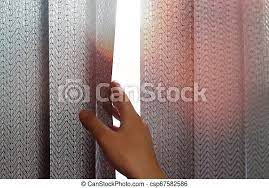 There are a few things you should know when cleaning them. Hand Opens Black Vertical Blinds Of Fabric On The Window Close Up Canstock
