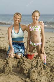 Mother and Daughter Building Sand Castle Stock Photo by ©londondeposit  33800461