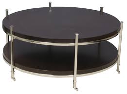 Every decorative trunk is one part coffee table, one part storage chest, and one part decorative art. Vanguard Furniture Accent And Entertainment Chests And Tables Gibson Round Cocktail Table With Shelf And Stainless Steel Legs And Casters Belfort Furniture Cocktail Coffee Tables
