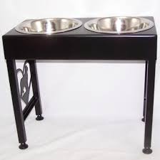 Dogs will have a hard time making a mess with this beautiful wooden feeder that at 3 pounds, is hard along with offering a food and water dish, the iris elevated feeder also includes an airtight storage compartment, which is handy for stashing dog. Newfoundland Elevated Metal Art Dog Feeder Raised Bowl Holder New Size Modern Iron Works