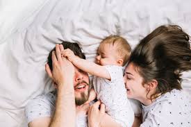 Free Photo Young Couple With Baby In The Morning
