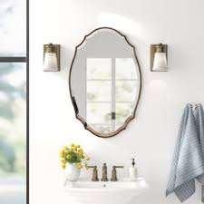 Add a few mirrors in your home to both add light and create the illusion of more space. Rubbed Bronze Vanity Mirror Wayfair