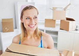 Es ist im us letter format zu drucken. Positive Frau Tragt Boxen Zu Hause Lizenzfreie Fotos Bilder Und Stock Fotografie Image 10242894