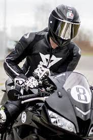 Biker With A Cool Agv Helmet And Hot Dainese Race Suit Sitting On His Honda Motorcycle Cool Motorcycle Helmets Biker Photoshoot Motorcycle