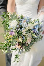 This creates a beautifully coordinated event. A Wild Blue Bridal Bouquet For A Beach Wedding Chic Vintage Brides