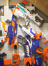 Have a bunch of nerf guns laying around and want to get them out of the way and also add an awesome nerf gun rack to your room? Easy Diy Nerf Gun Storage From Thrifty Decor Chick