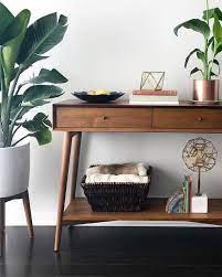If you like the design and ideals of this style, then follow these decor suggestions to upgrade your living room. Mid Century Console Acorn In 2021 Mid Century Modern Console Table Mid Century Console Console Table Decorating