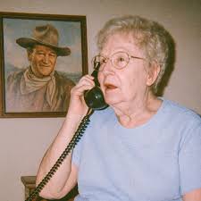 ChatGPT V. ImageFX "grainy disposable camera footage of john wayne prank  calling an old lady and telling her that they're going to missouri"
