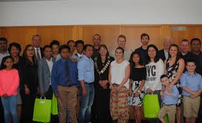 21 new citizens trace a path across the globe to become Australians at a  ceremony in Singleton