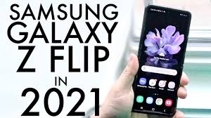 The phone turns to show the hideaway hinge and then multiple galaxy z flip 5g phones appear, alternating between mystic bronze and mystic gray. Samsung Galaxy Z Flip In 2021 Still Worth Buying Review Youtube
