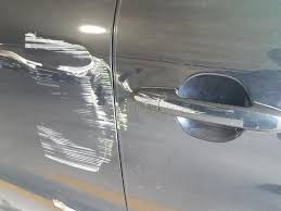 Here is an exhaustive read for all types of car scratches you need to know. White And Yellow Scratches On Side Of Black Car Stock Photo Image Of Accident Automobile 134883776