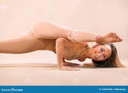 Indoor Yoga Classes. Sports Recreation. Beautiful Young Woman in Asana  Pose. Individual Sports. Nude Sportswear. Stock Photo - Image of healing,  balance: 168453956