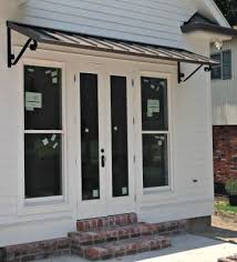 While major home construction and landscape projects require much planning, the option of incorporating awnings into your home design has many practical and decorative benefits. The Bronze Classic Metal Awning With The Single S Scrolls In New Orleans La House Awnings Door Awnings Awning Design