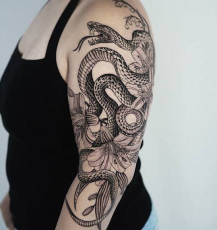 Snake and botanical half sleeve for the strong Breanna 🖤 Bay Area, Oakland (California) @futureink.co • #darkbotanicaltattoo #snaketattoo #oaklandtattooartist #sftattooartist #bayarea #blackwork #tattoo