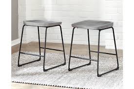 Bar and counter stools are a great way to add functional seating and style to your space. Showdell Counter Height Bar Stool Ashley Furniture Homestore