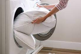 Pillows filled with down or feathers shouldn't be machine washed because the detergent will cause the filling to stick together. How To Wash Feather Bed Pillows