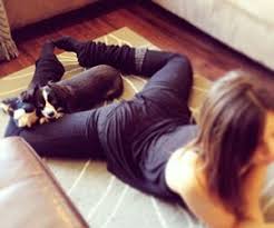 5 Easy Stretches To Do While Watching Tv Worldlifestyle Easy Stretches Pilates Flexibility Going To The Gym