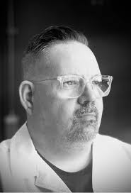 The three gentlemen pictured were promoting a new shop for larger mens  clothing in Carlisle. Where was the photograph taken? Does anyone know if  it is still trading and where it is?