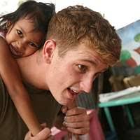 Lt. Sam Lieber interacts with students at Assumption School in Majuro,  Marshall Islands during a during Pacific Partnership 2019 host nation  engagement.