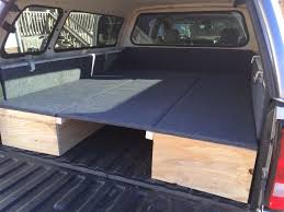 Here S A Pic Of The Center Board Raised In Place To Create A Queen Sized Bed I Have A Queen Air Mattress That Fits Rig Truck Bed Camping Camping Bed Truck