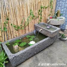 Maybe you would like to learn more about one of these? Stone Trough Fish Tank Water Trough Stone Flowerpot Old Ox Trough Grinding Plate Paleolithic Combination Waterscape Indoor Courtyard Ornaments