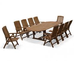 Check out our extendable dining table selection for the very best in unique or custom farmhouse dining table with bench, dining set, farmhouse furniture, farmhouse kitchen table, x table, trestle table. Bali 10 Seater Teak Extending Dining Table And Reclining Chairs Set Lindsey Teak