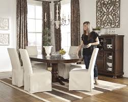 Rated 4.5 out of 5 stars. The Warm Rustic Beauty Of The Porter Dining Room Collection Uses A Deep Finish And Ornate Det Ashley Furniture Dining Table Ashley Furniture Dining Room Sets