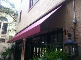 2 of space is required on both sides for wall brackets. Nola Awning