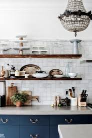 There is something about floating shelves that make them part of nearly every home's décor be it in the kitchen, bathroom or even garage. How To Style Your Open Kitchen Shelving